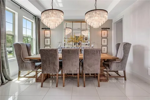 a living room with furniture a flat screen tv and a window