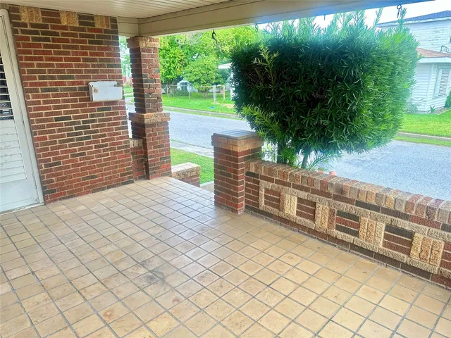 a balcony view with a garden