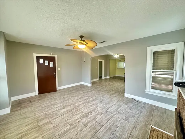 a view of an empty room and window