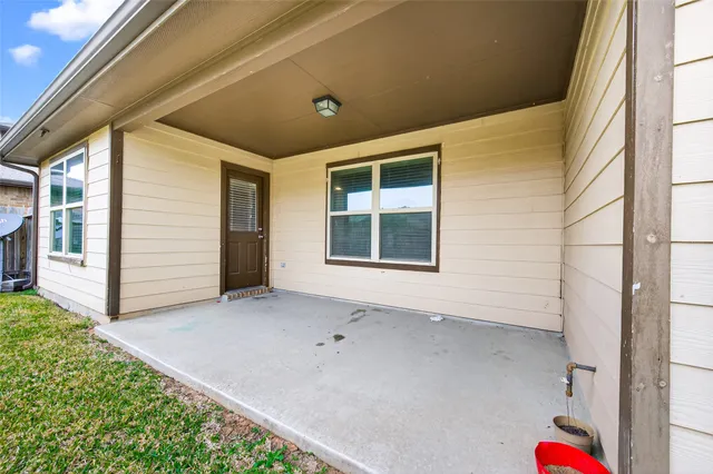 a view of house with backyard