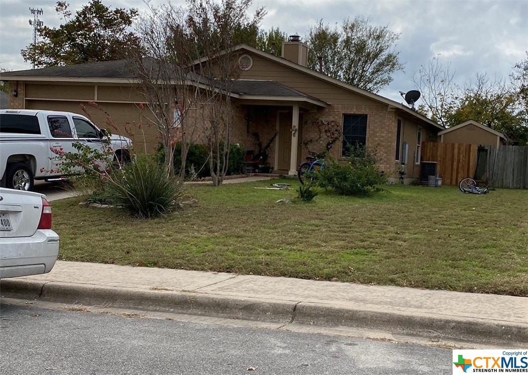 169 Spring Branch Loop Kyle, TX 78640 - Photo 1 of 1 a view of a house with backyard and garden