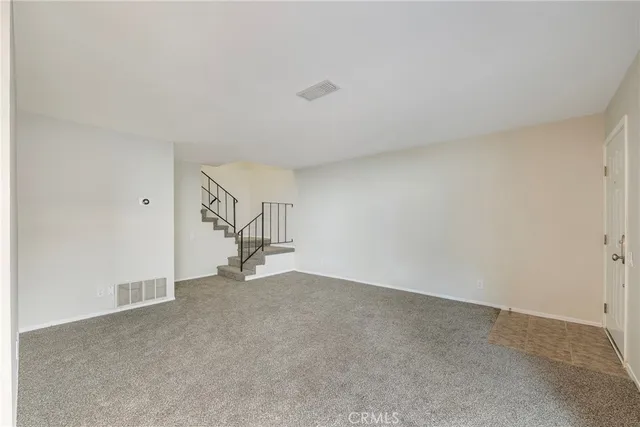 a view of a hallway with windows