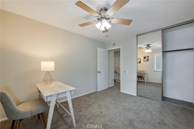 a view of a livingroom with a workspace