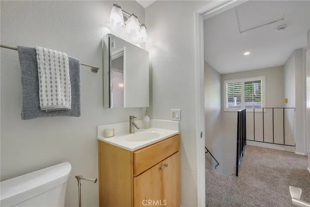 a view of a house with a large tree