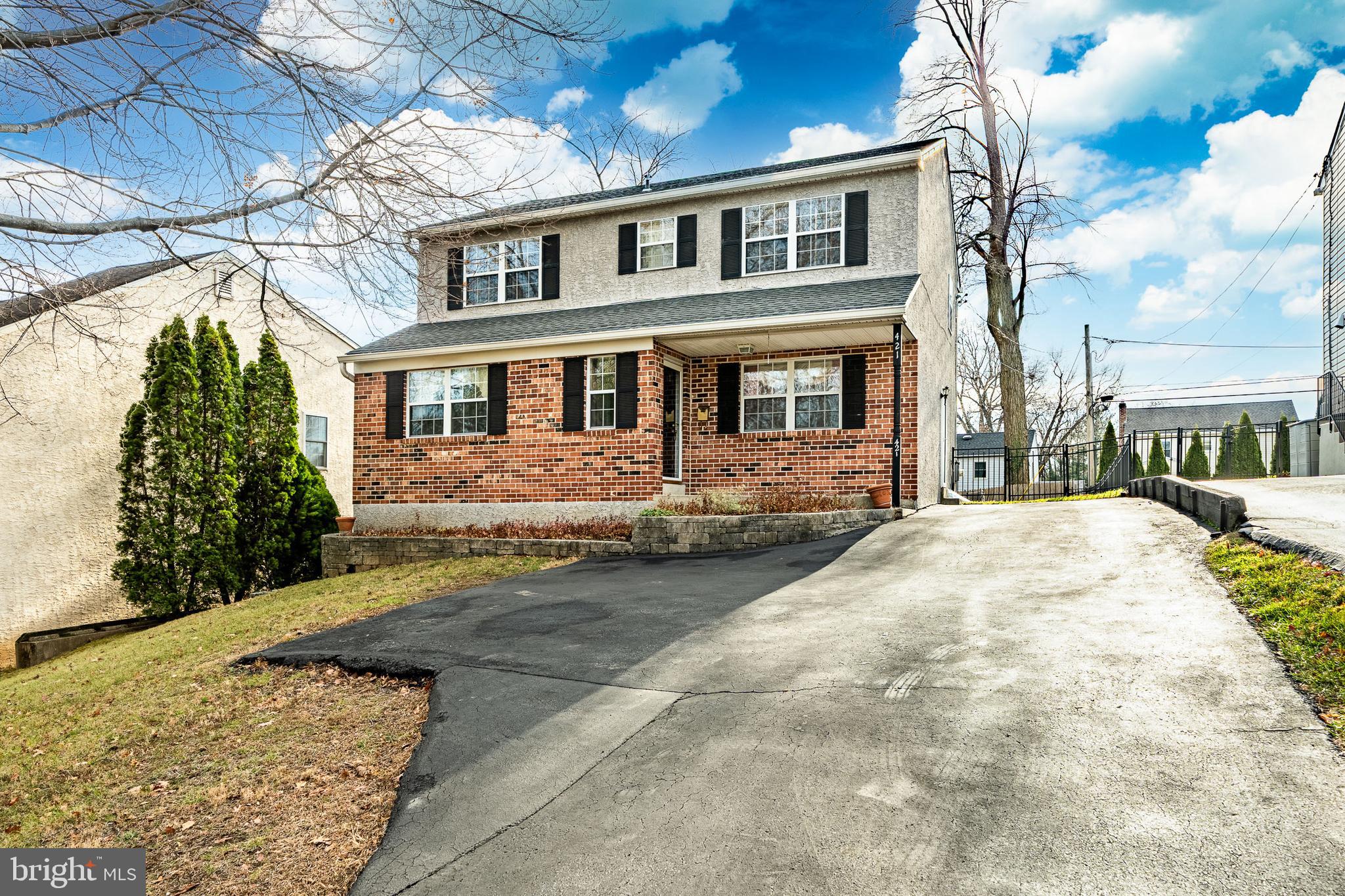 421 East Eagle Road Havertown, PA 19083 - Photo 1 of 49 a front view of a house with a yard
