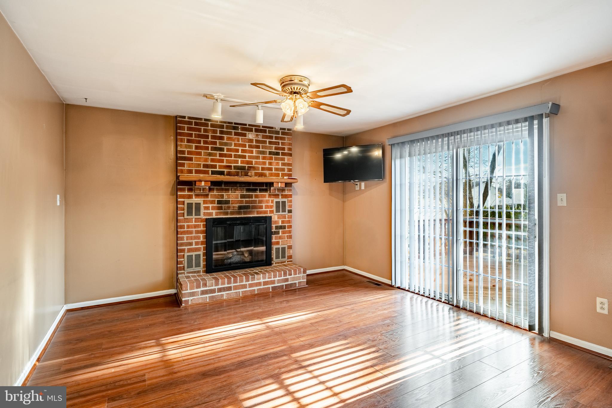 421 East Eagle Road Havertown, PA 19083 - Photo 13 of 49 a view of a livingroom with wooden floor and a ceiling fan