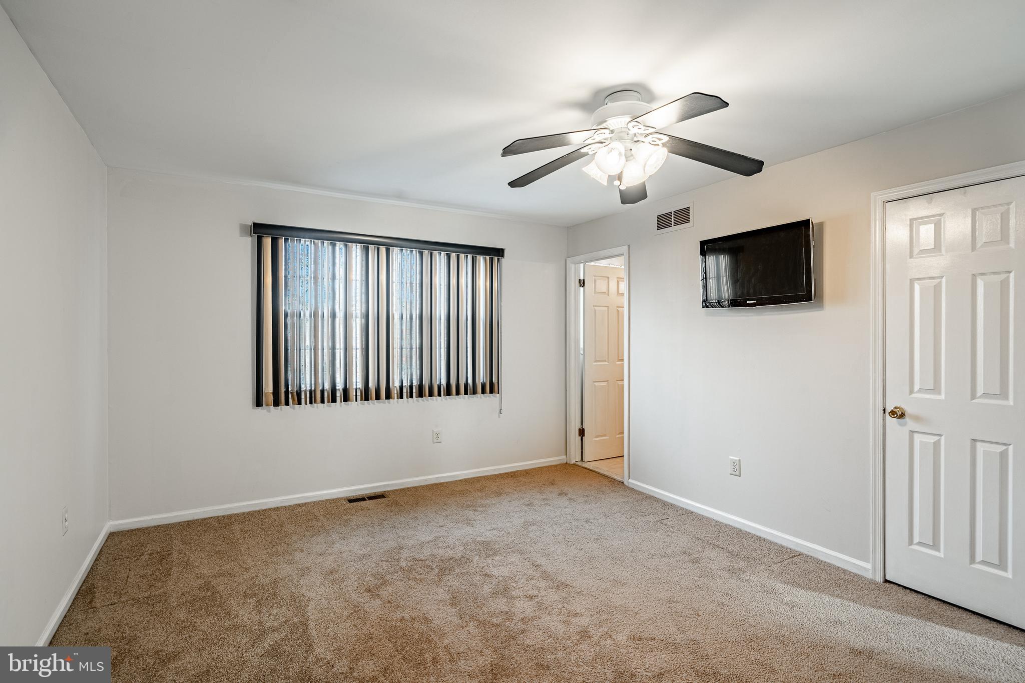 421 East Eagle Road Havertown, PA 19083 - Photo 18 of 49 a view of an empty room with a window and a flat screen tv