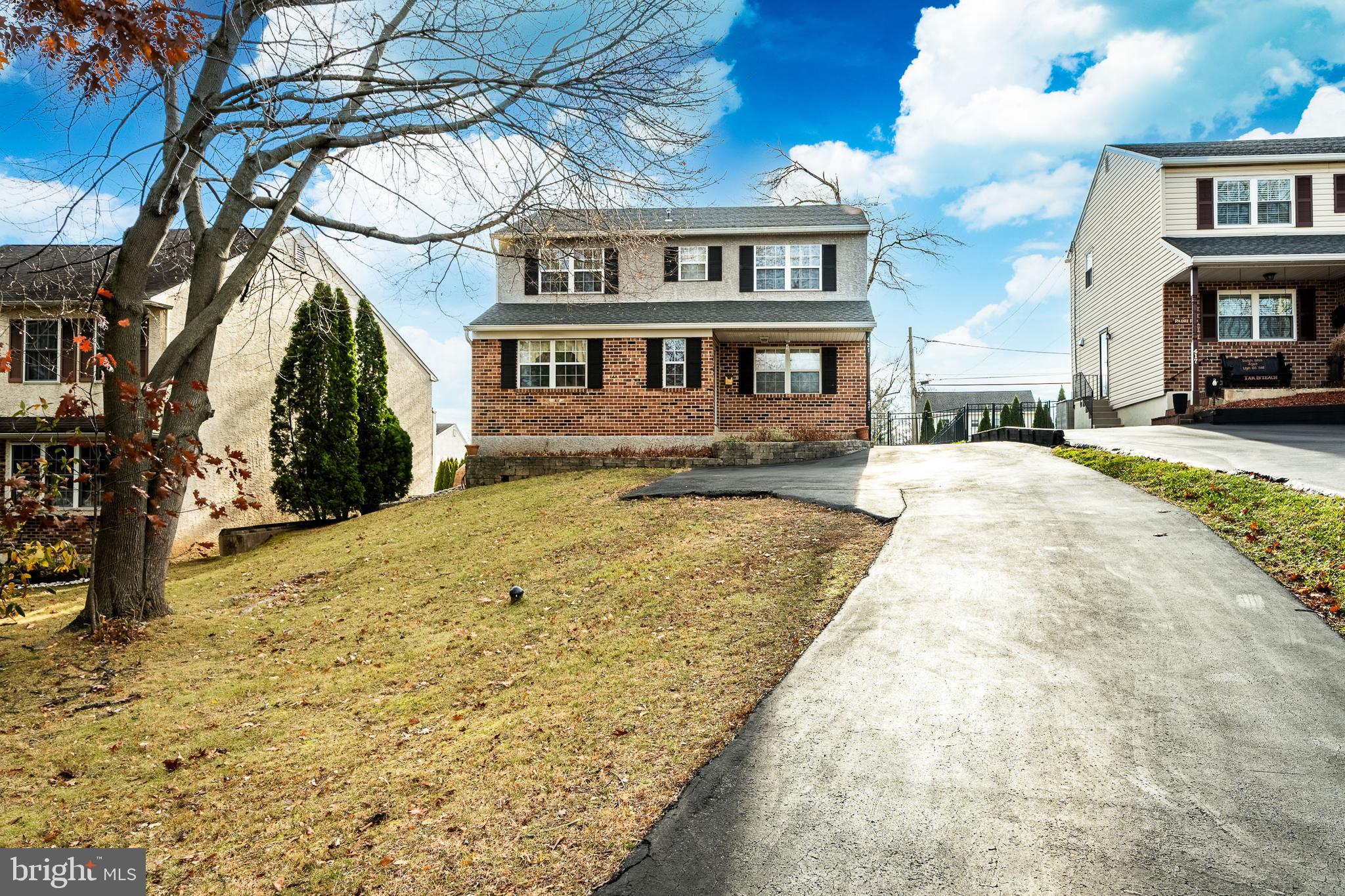 421 East Eagle Road Havertown, PA 19083 - Photo 2 of 49 a front view of a house with a yard