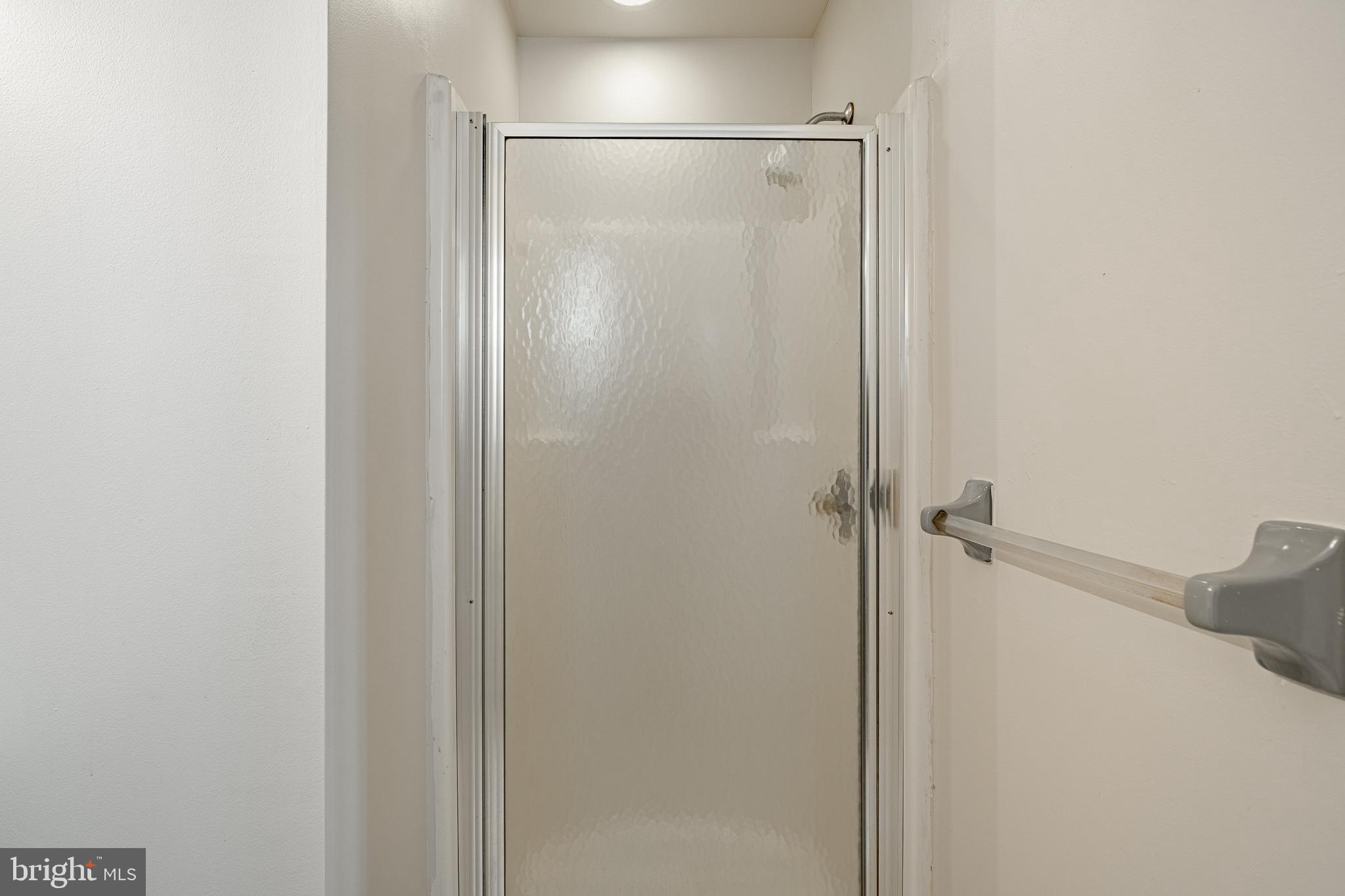 421 East Eagle Road Havertown, PA 19083 - Photo 21 of 49 a bathroom with a glass shower door