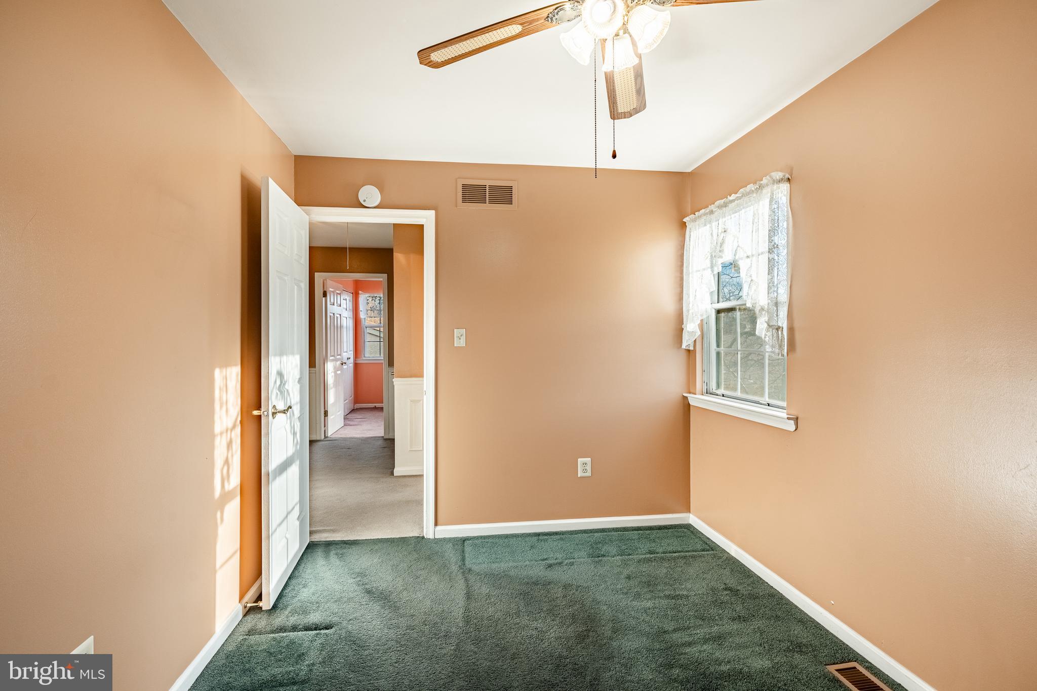 421 East Eagle Road Havertown, PA 19083 - Photo 28 of 49 a view of a hallway with a window and chandelier fan