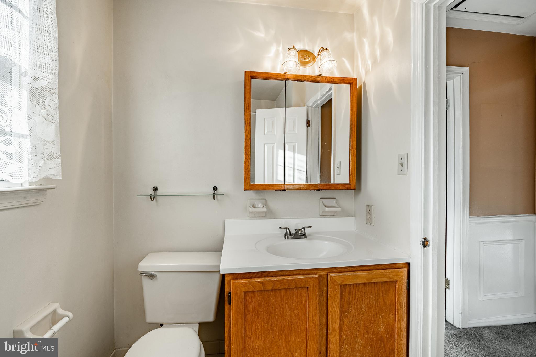 421 East Eagle Road Havertown, PA 19083 - Photo 29 of 49 a bathroom with a toilet sink and mirror