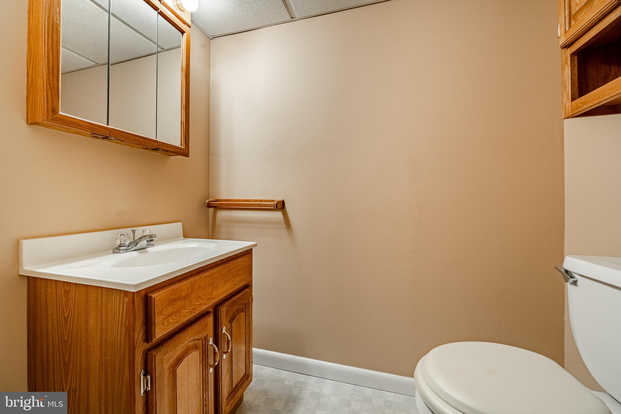 421 East Eagle Road Havertown, PA 19083 - Photo 32 of 49 a bathroom with a sink a toilet and mirror