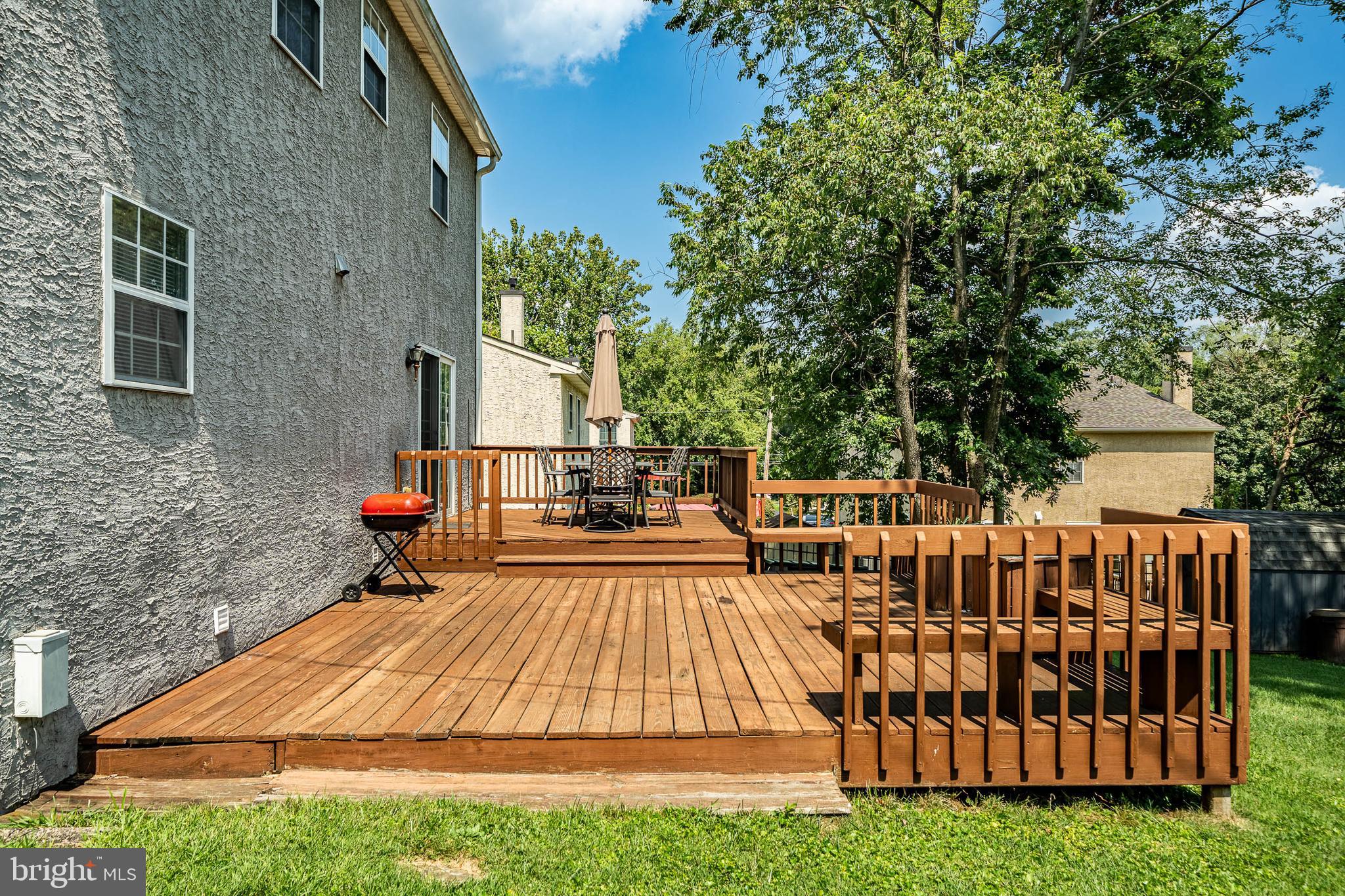 421 East Eagle Road Havertown, PA 19083 - Photo 40 of 49 a view of backyard with a deck and furniture