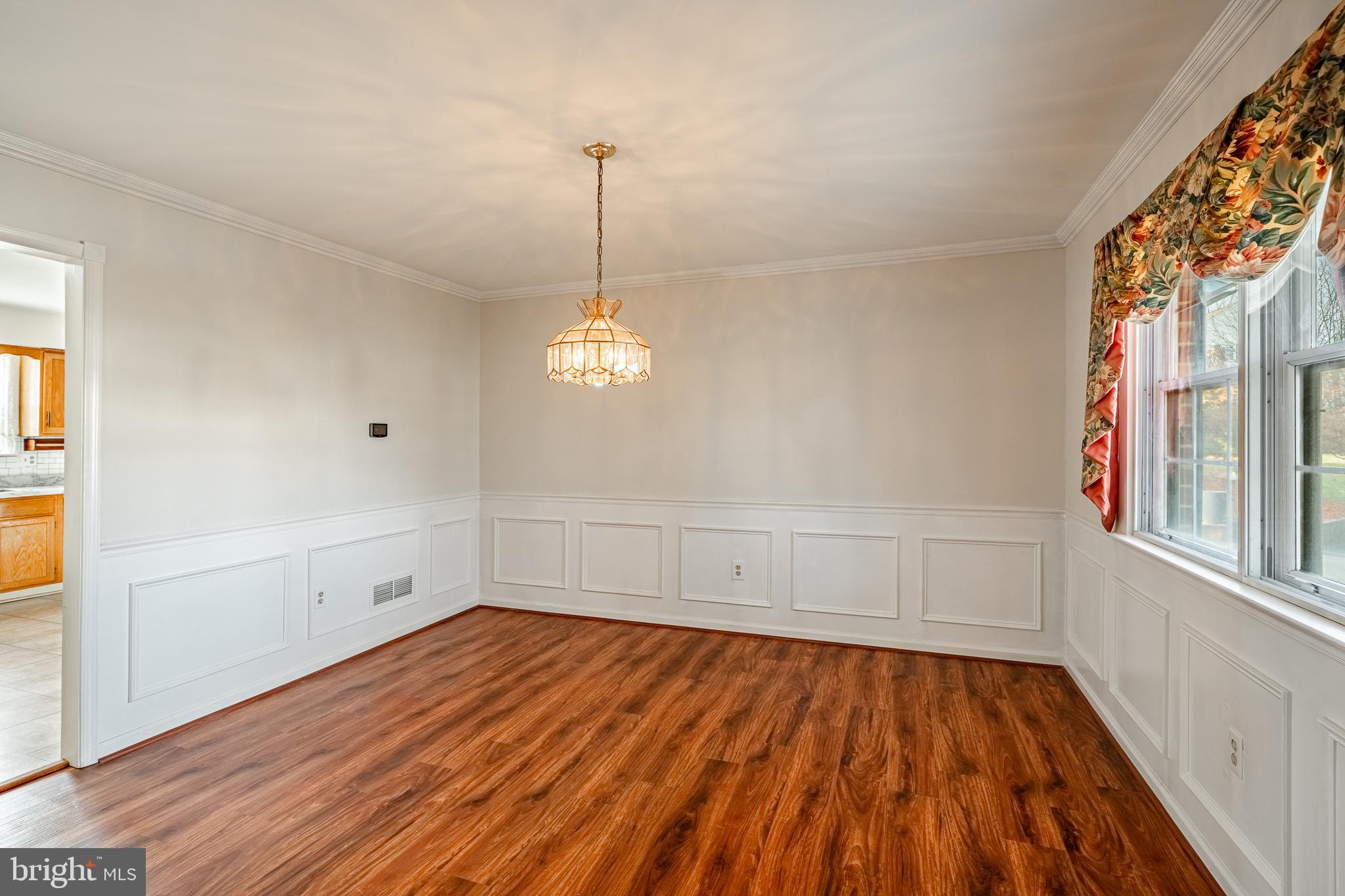 421 East Eagle Road Havertown, PA 19083 - Photo 8 of 49 a view of empty room with wooden floor and fan