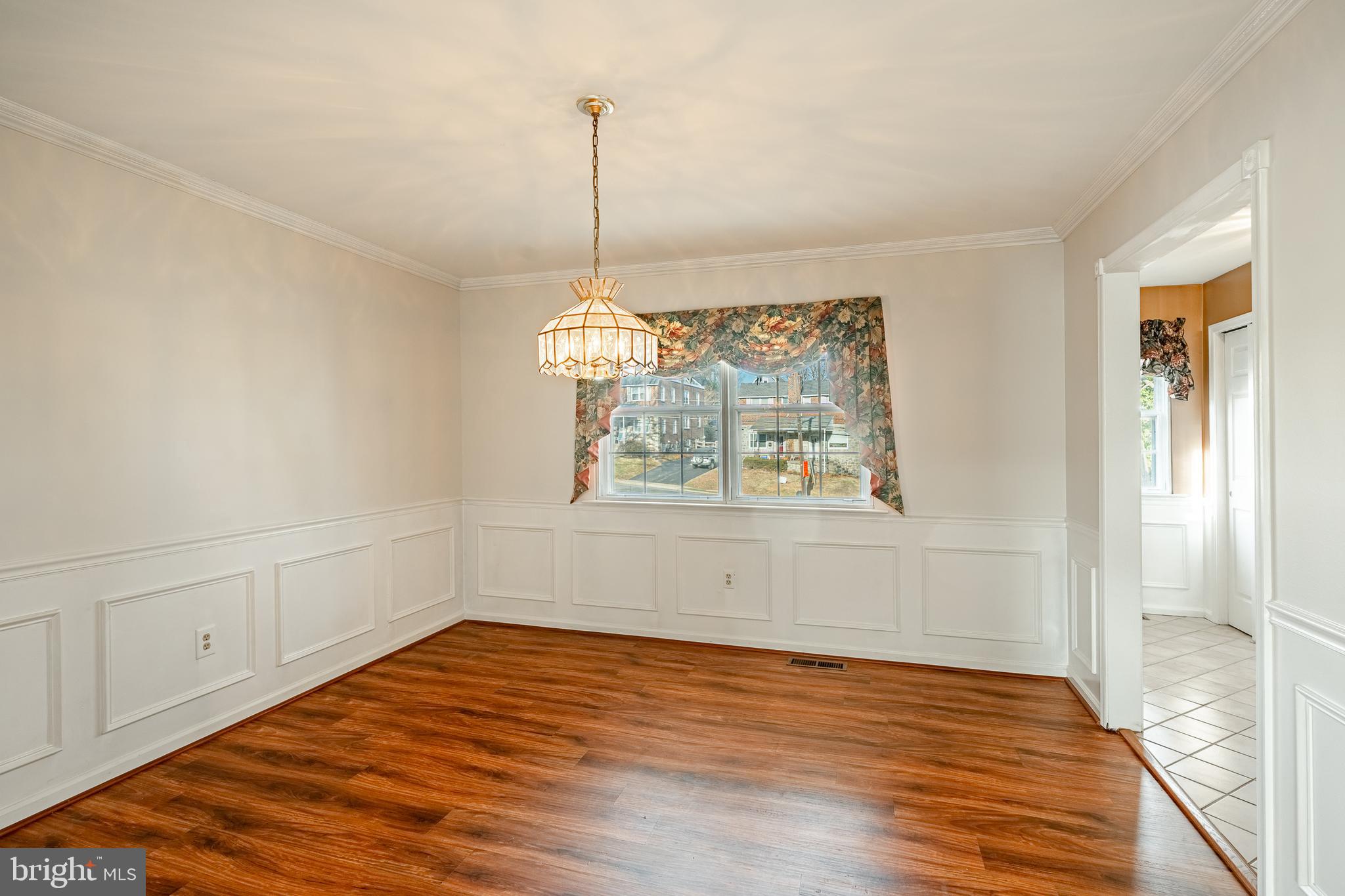 421 East Eagle Road Havertown, PA 19083 - Photo 9 of 49 a view of empty room with wooden floor and fan
