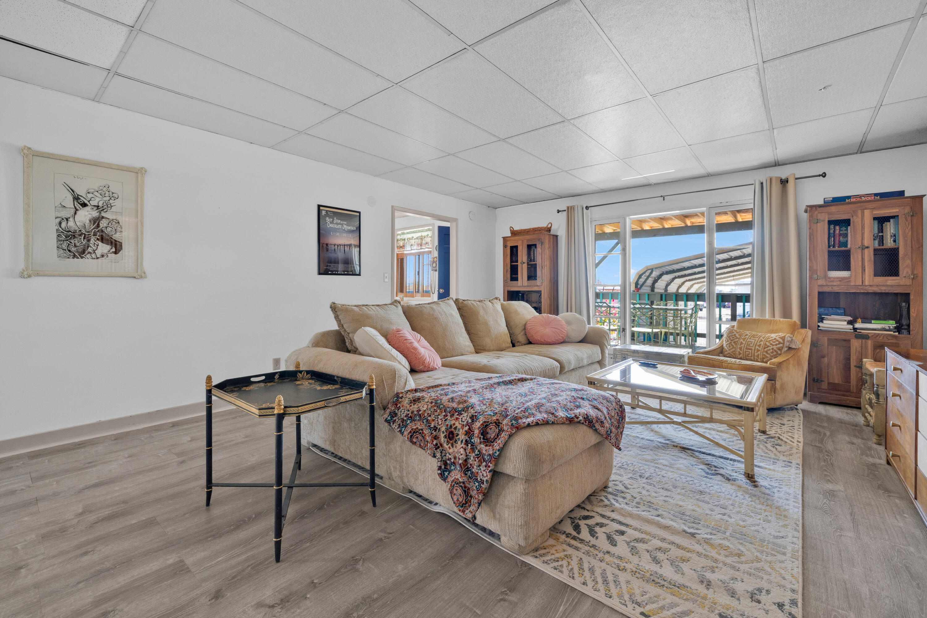 2180 3rd Street Bombay Beach, CA 92257 - Photo 3 of 4 a spacious bedroom with a bed a table and painting on the wall
