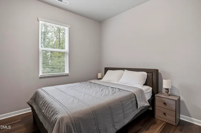 a bathroom with a sink vanity mirror and toilet