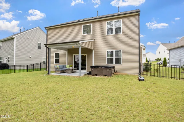 a view of a house with swimming pool porch and furniture