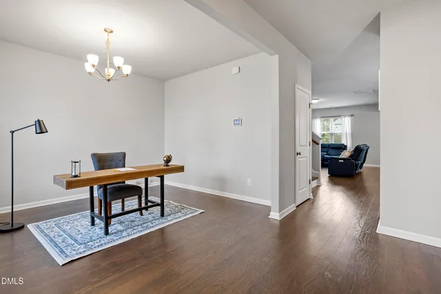 a workspace with furniture and a window