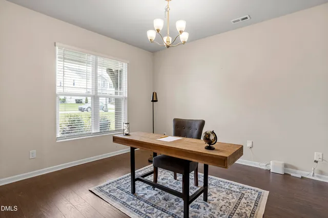 a living room with furniture a window and a fireplace