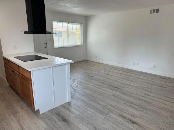 a kitchen with stainless steel appliances a sink and a refrigerator
