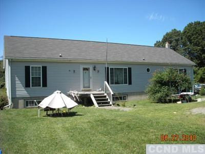 73 Preusser Road Claverack, NY 12521 - Photo 1 of 1 front view of a house with a yard