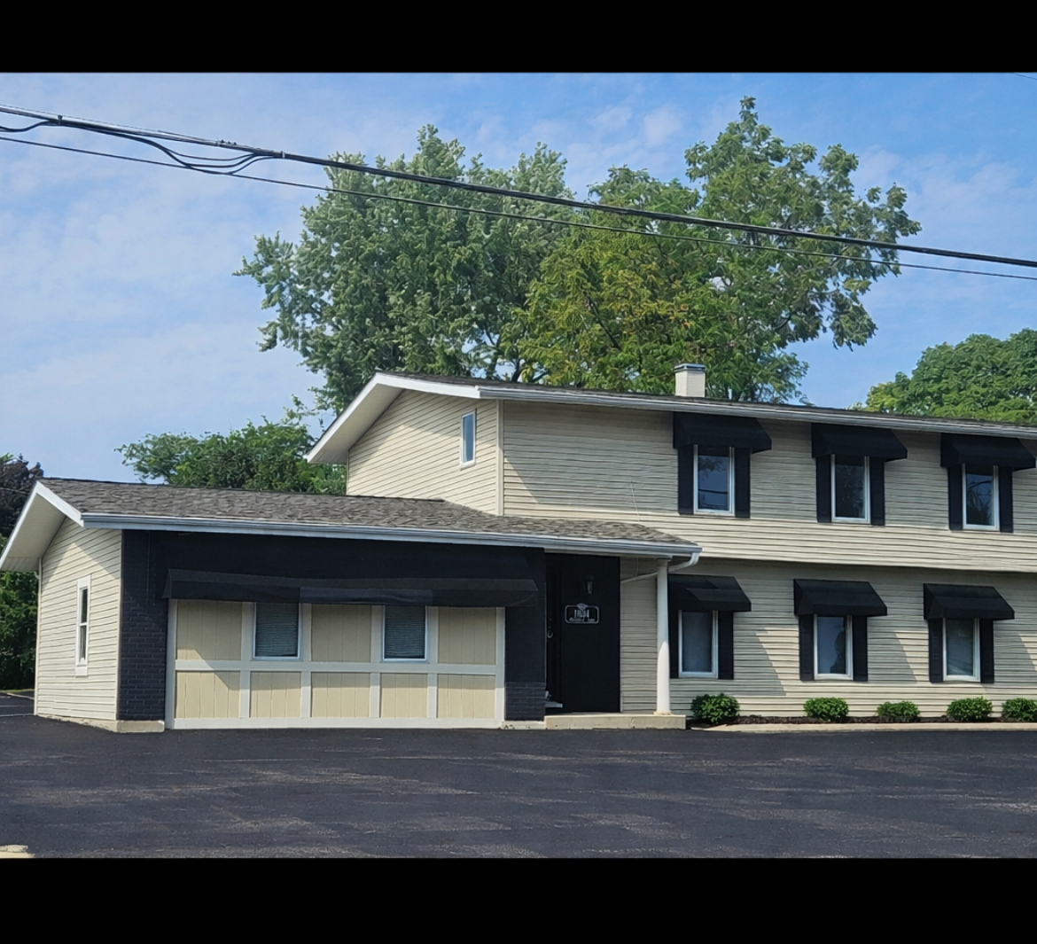 11614 West Algonquin Road, Unit 2B Huntley, IL 60142 - Photo 1 of 14 a front view of a house with a yard