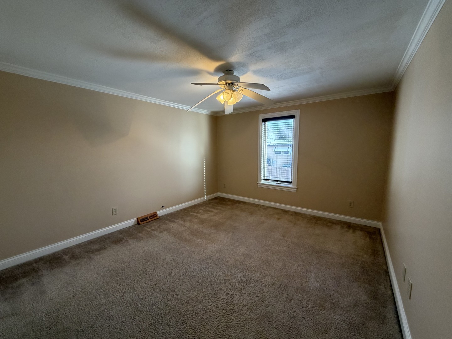 11614 West Algonquin Road, Unit 2B Huntley, IL 60142 - Photo 12 of 14 an empty room with windows and fan