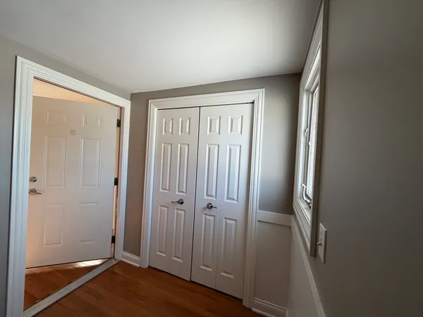 an empty room with wooden floor