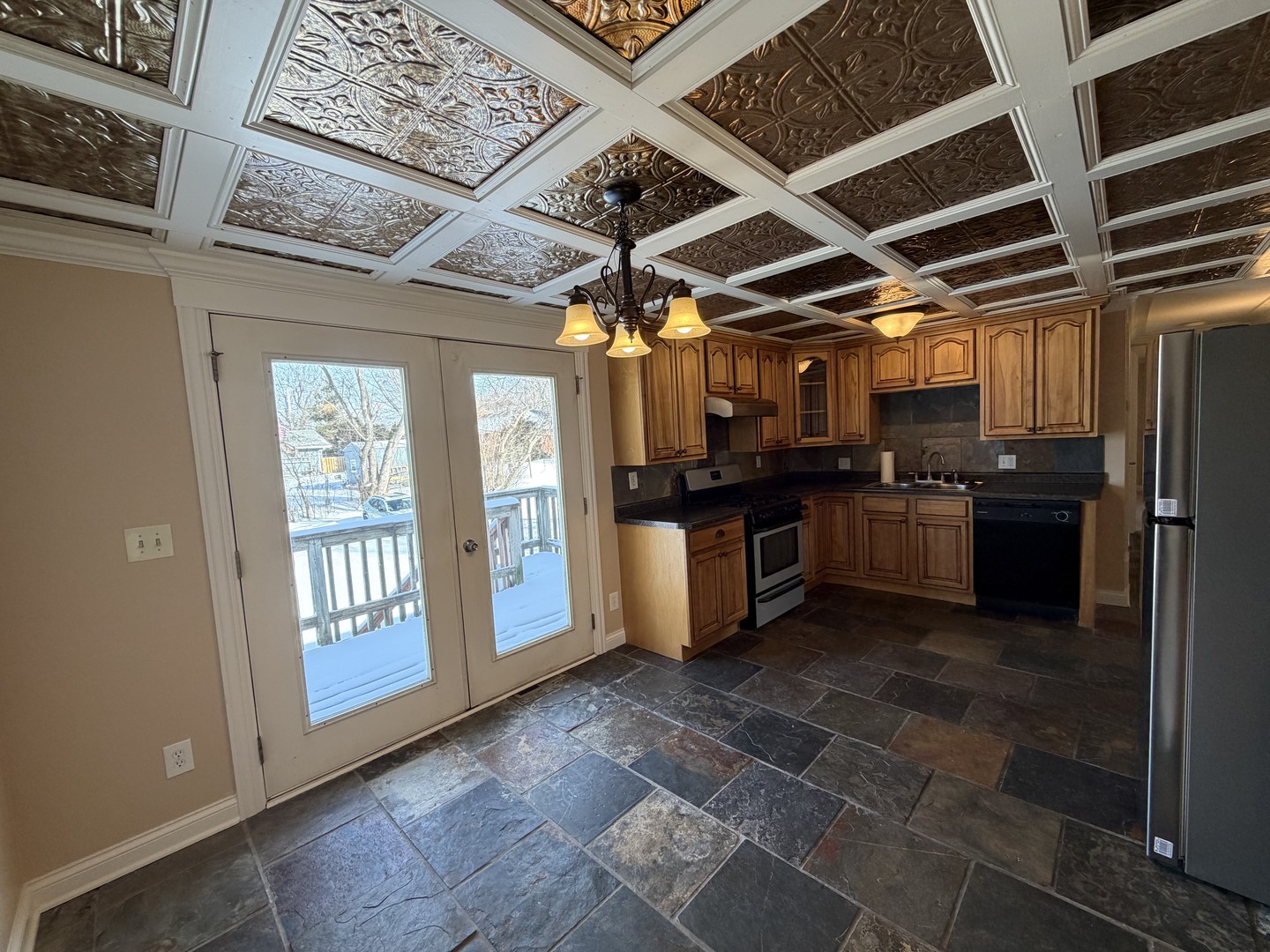 11614 West Algonquin Road, Unit 2B Huntley, IL 60142 - Photo 6 of 14 a kitchen with stainless steel appliances granite countertop a stove a sink and a refrigerator