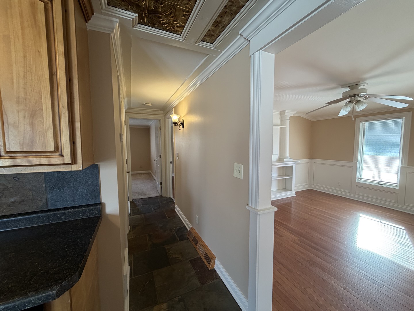 11614 West Algonquin Road, Unit 2B Huntley, IL 60142 - Photo 7 of 14 a view of a hallway with wooden floor and staircase