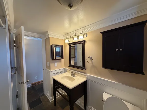 a bathroom with a sink a mirror and shower