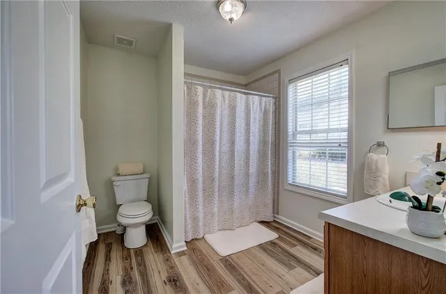 a bathroom with a sink toilet a tub and shower
