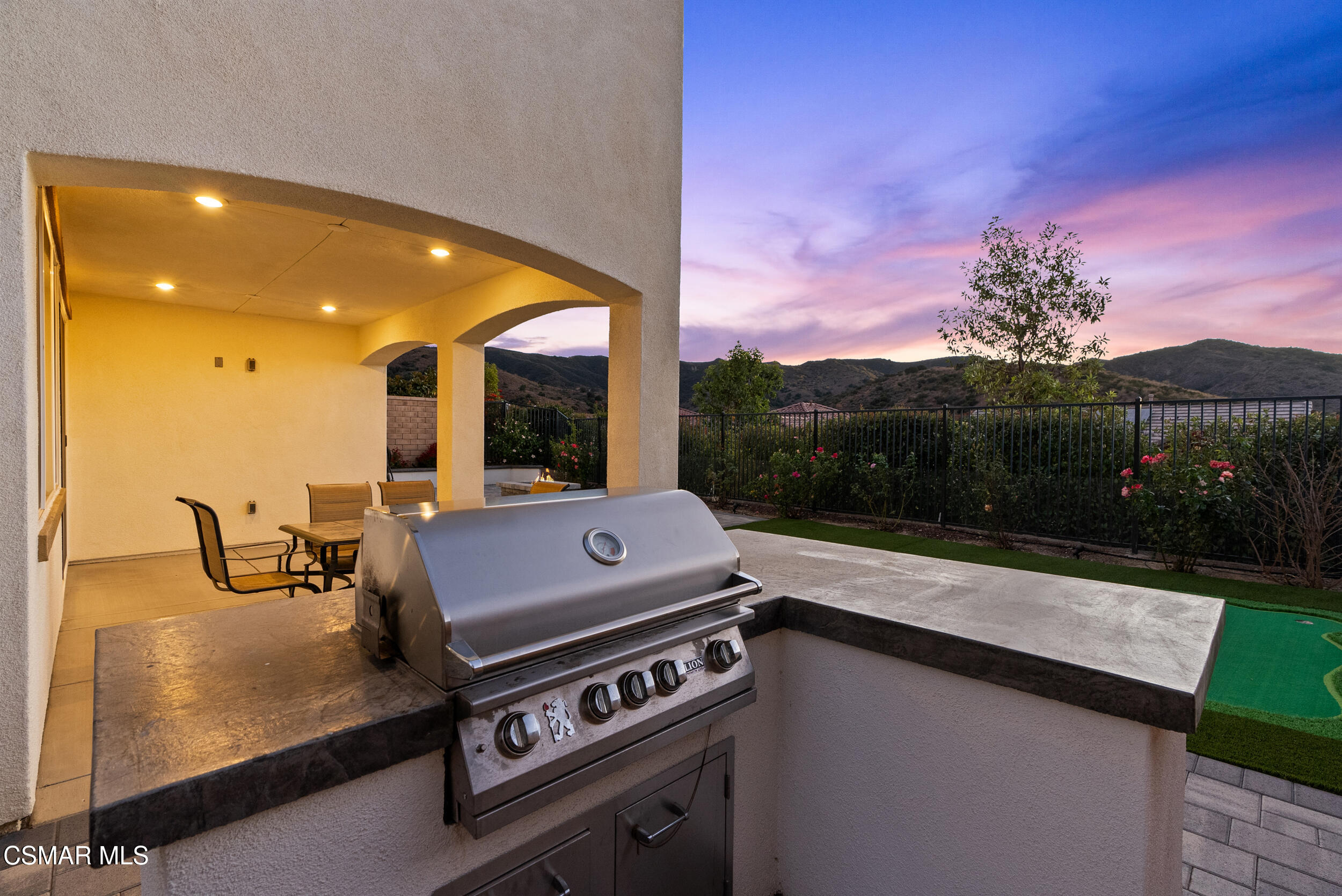 161 White Bark Lane Simi Valley, CA 93065 - Photo 16 of 83 a view of a patio with a table and chairs