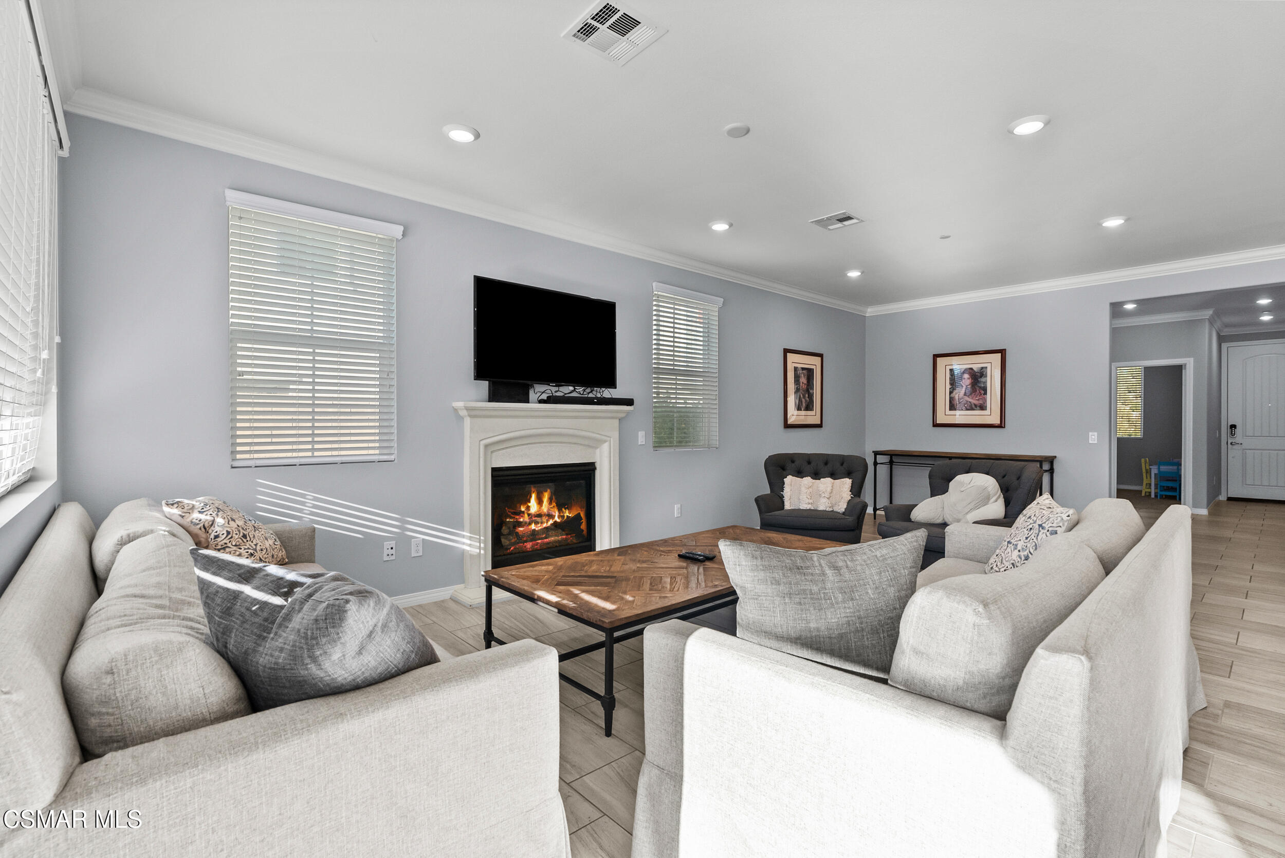 161 White Bark Lane Simi Valley, CA 93065 - Photo 27 of 83 a living room with furniture a flat screen tv and a fireplace