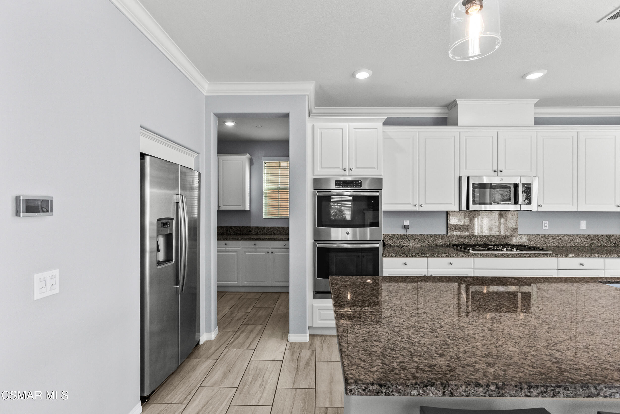 161 White Bark Lane Simi Valley, CA 93065 - Photo 34 of 83 a view of a kitchen with stainless steel appliances granite countertop a refrigerator and a sink