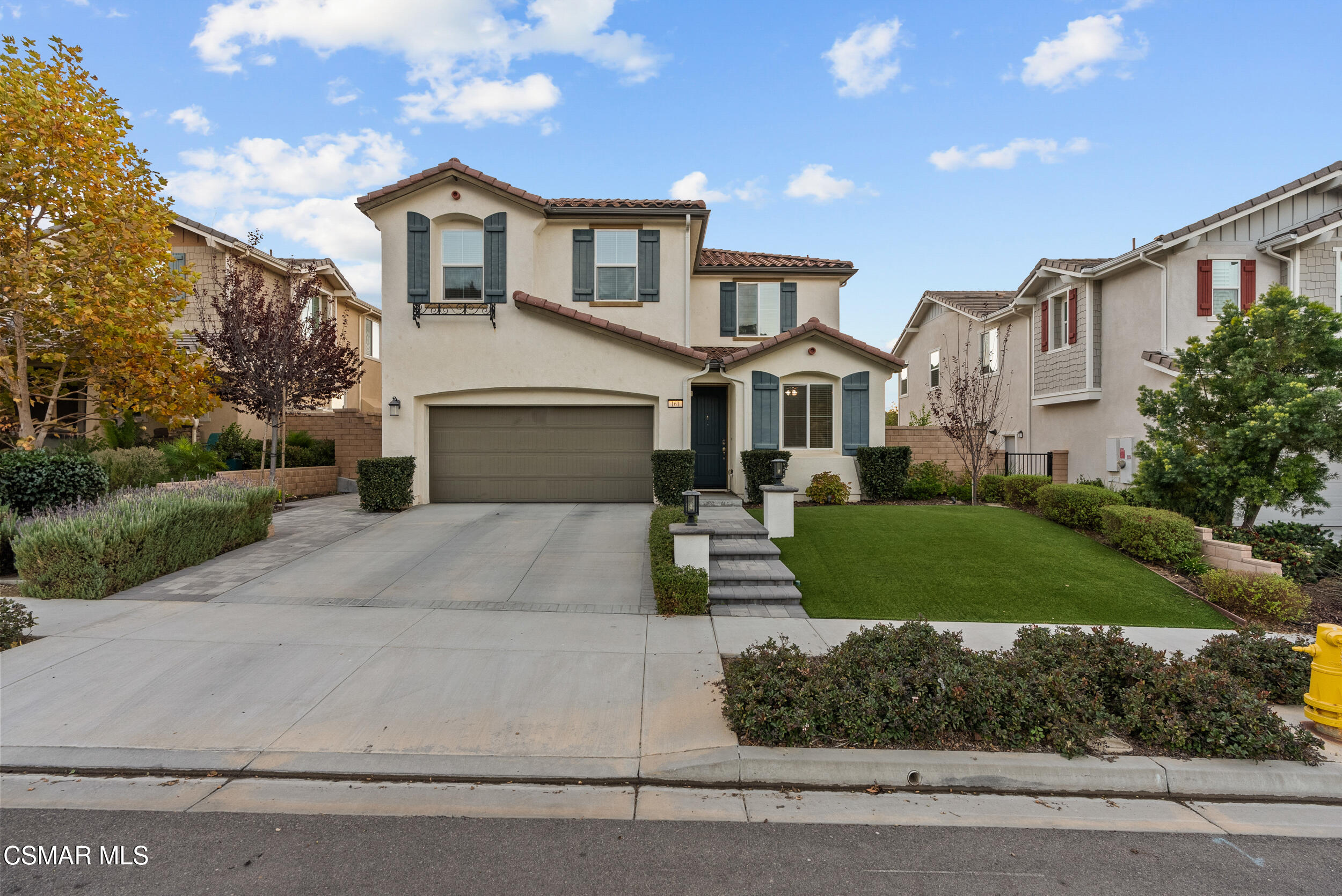 161 White Bark Lane Simi Valley, CA 93065 - Photo 4 of 83 a front view of a house with a yard and garage