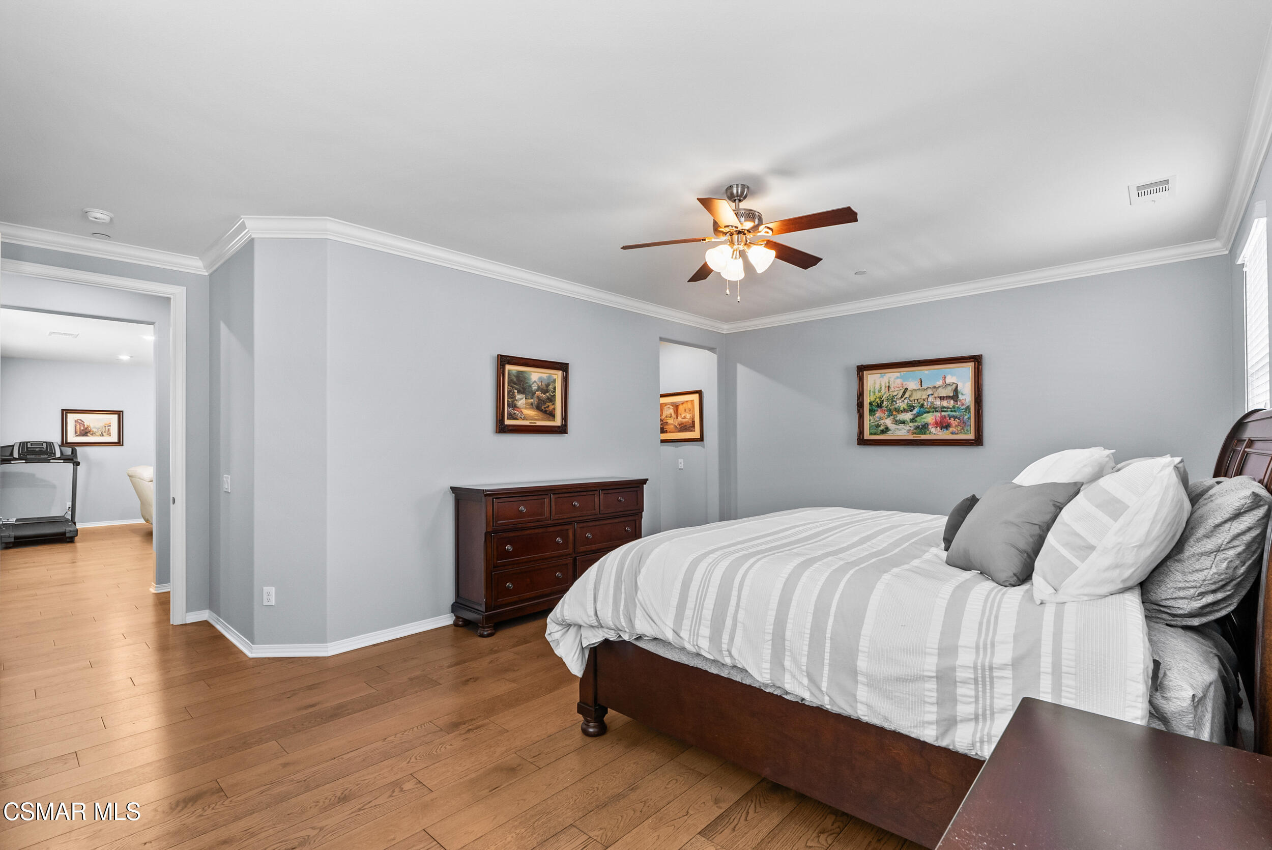 161 White Bark Lane Simi Valley, CA 93065 - Photo 53 of 83 a bedroom with a bed and a chandelier