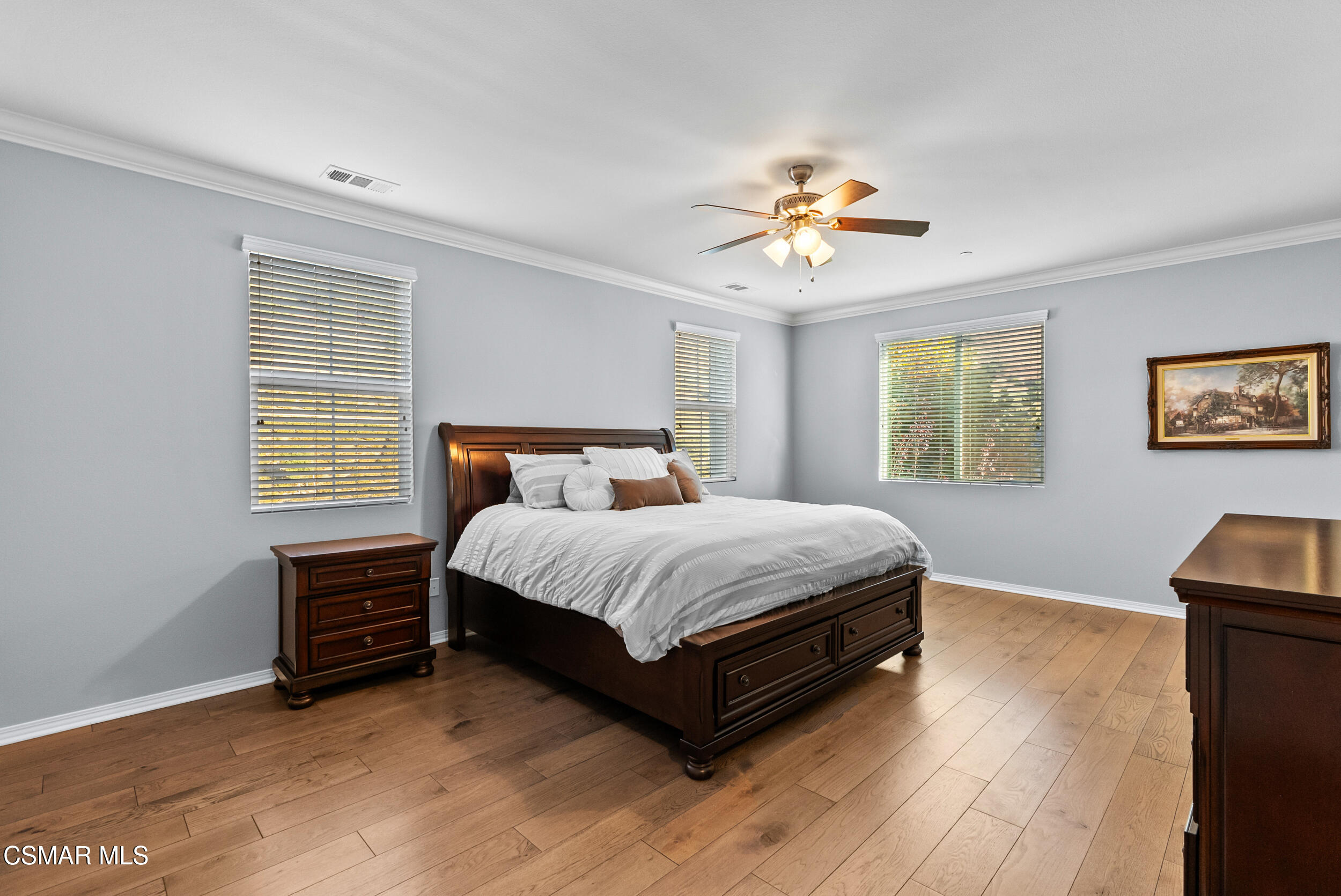 161 White Bark Lane Simi Valley, CA 93065 - Photo 54 of 83 a bedroom with a bed and a chandelier