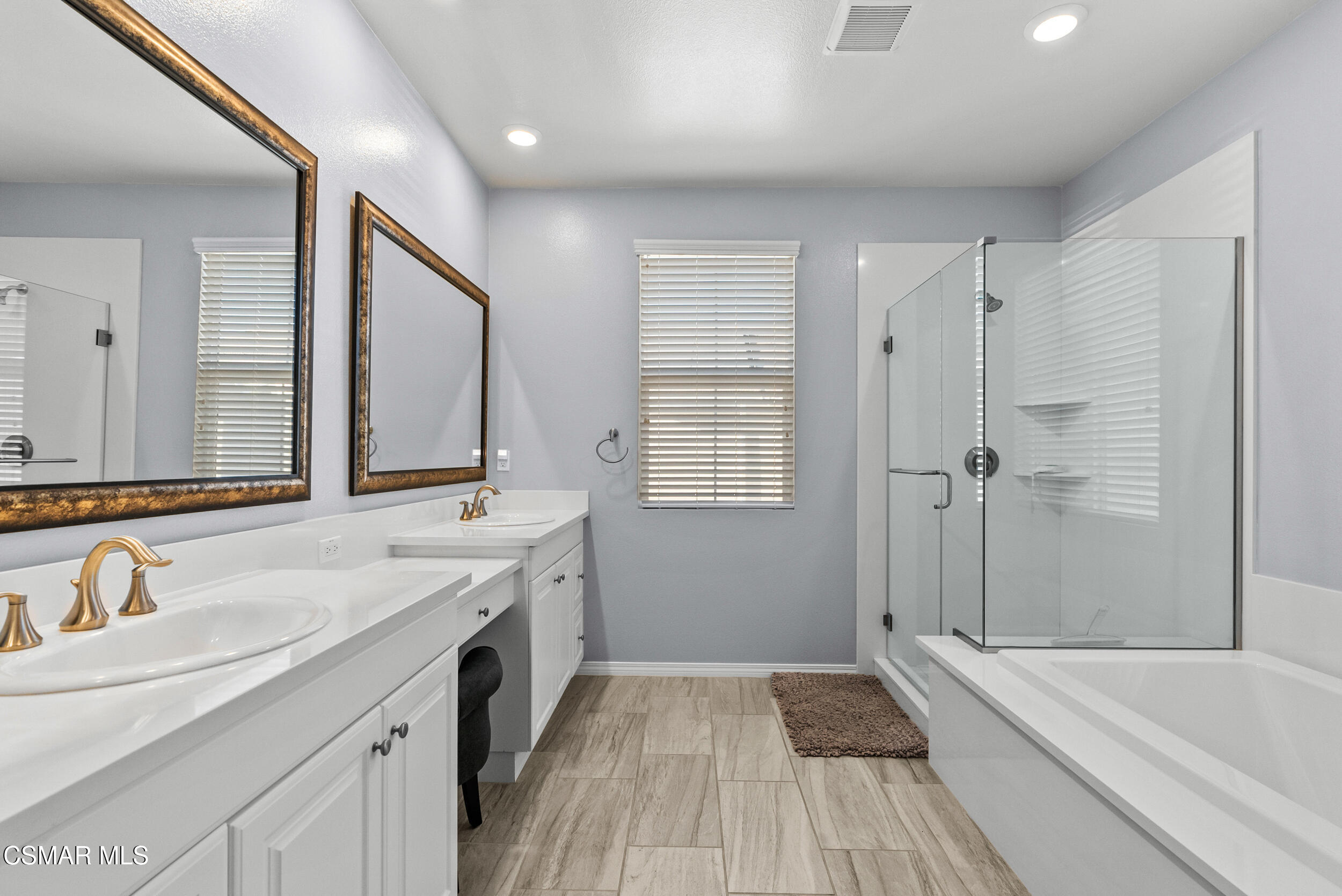161 White Bark Lane Simi Valley, CA 93065 - Photo 56 of 83 a spacious bathroom with a tub sink and mirror