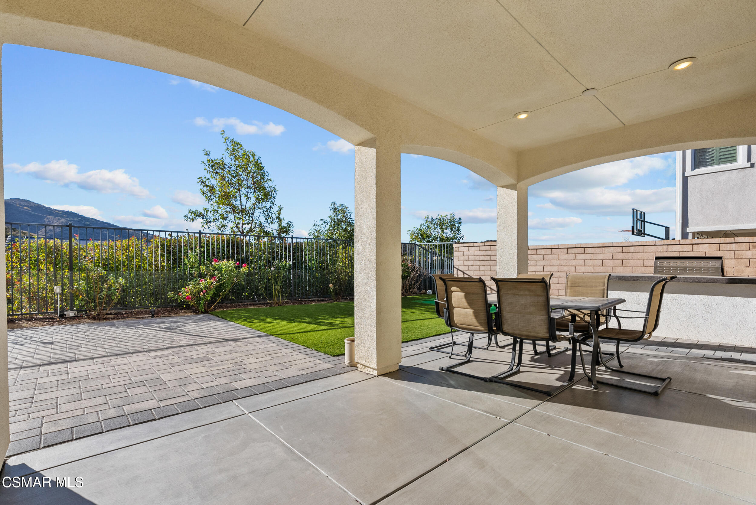 161 White Bark Lane Simi Valley, CA 93065 - Photo 66 of 83 a view of a patio with table and chairs and potted plants