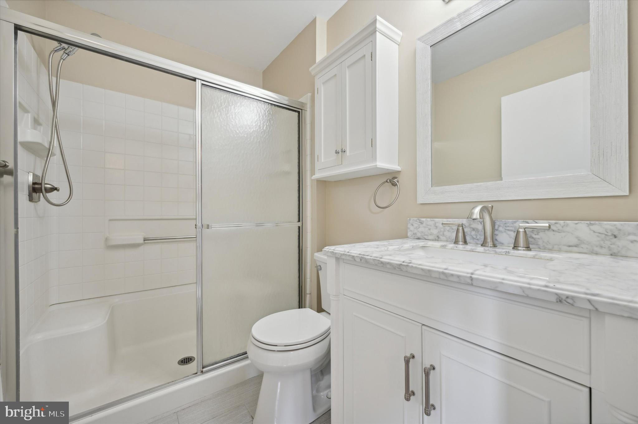 9 Meadow Lane Delran, NJ 08075 - Photo 14 of 15 a bathroom with a granite countertop sink toilet and shower