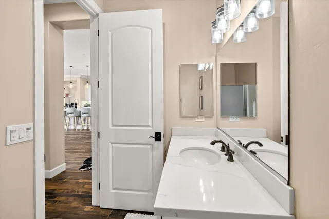 a bathroom with a sink a mirror and shower