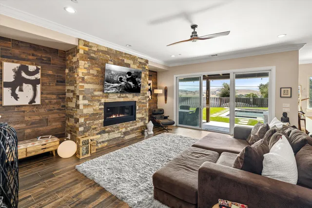 a living room with furniture and a fireplace