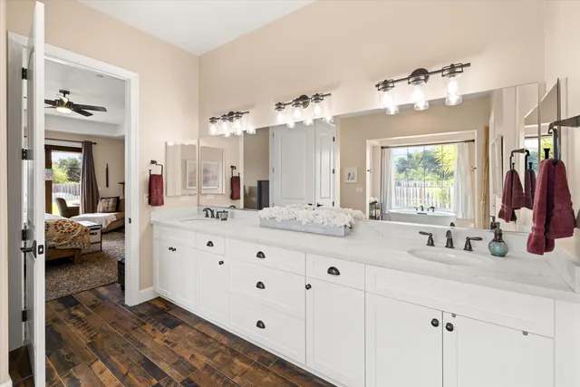 a bathroom with a sink vanity and a mirror
