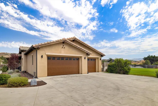 a view of a big yard with palm trees