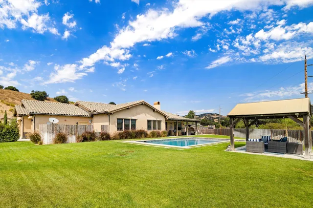 a view of a swimming pool with a lounge chairs