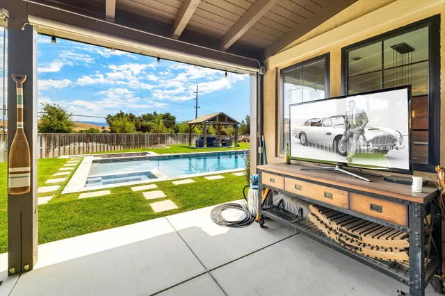 an aerial view of a house a swimming pool