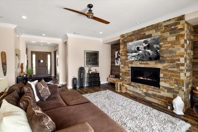 a living room with furniture and a fireplace