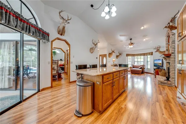 a living room with furniture fireplace and a large window